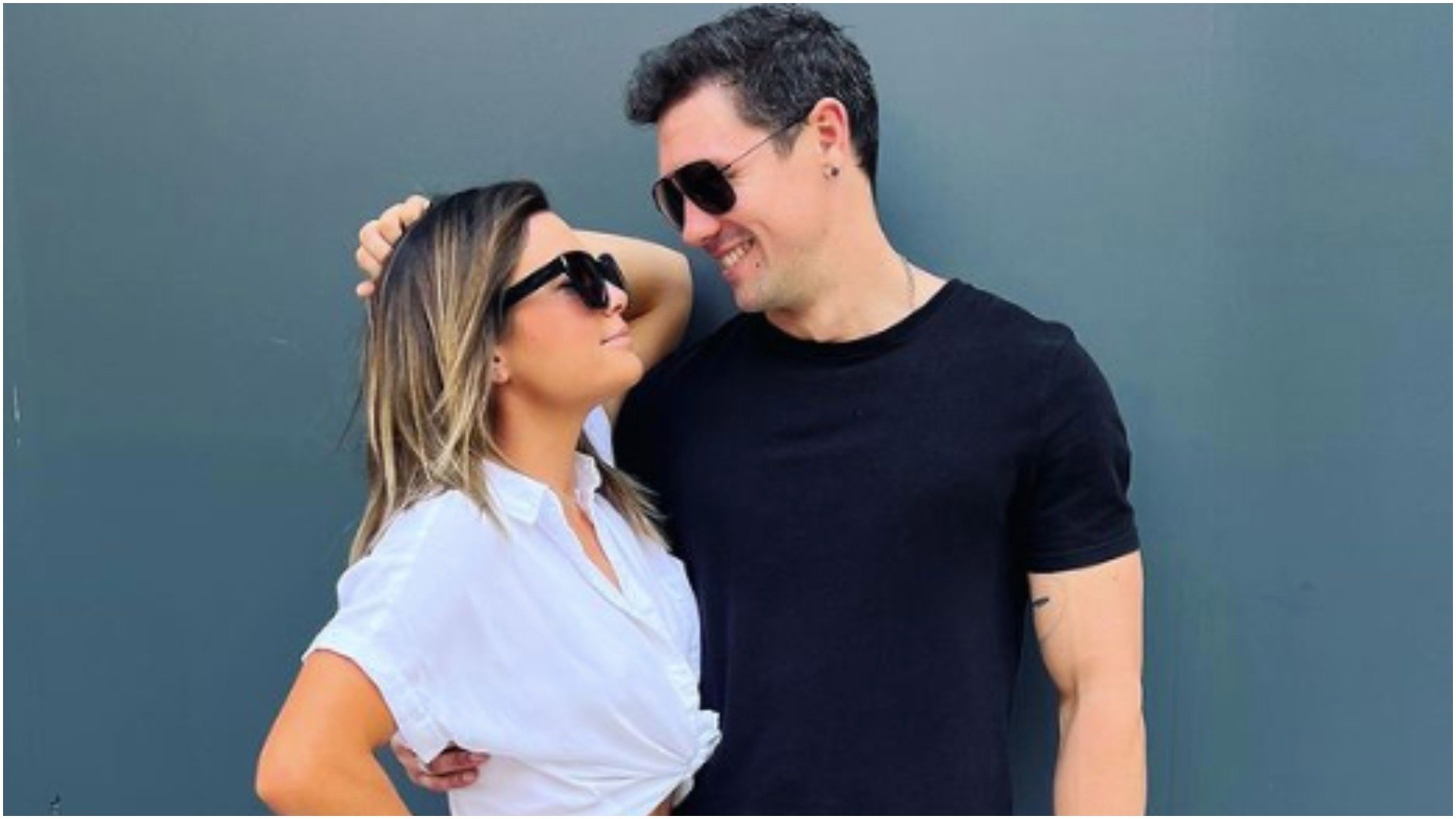 Malia White from Below Deck Med and Jake Baker smile at one another while wearing sunglasses.