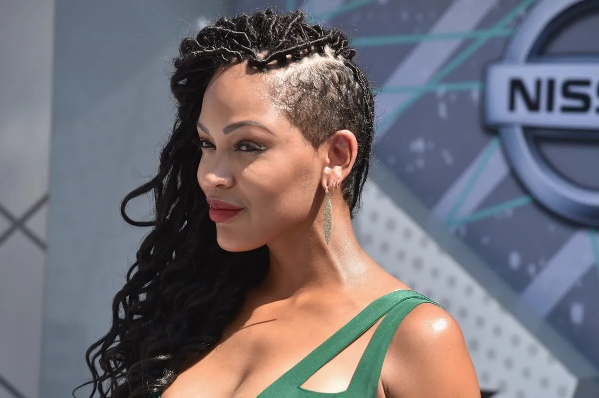 Meagan Good posing in a green dress at the BET Awards.