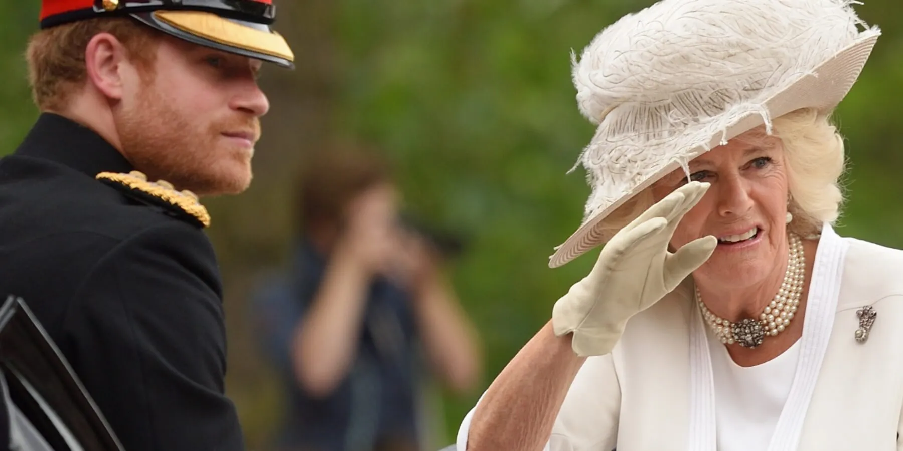 Prince Harry and Camilla Parker Bowles ride in a coach celebrating Trooping the Color on June 11, 2016 in London, England.