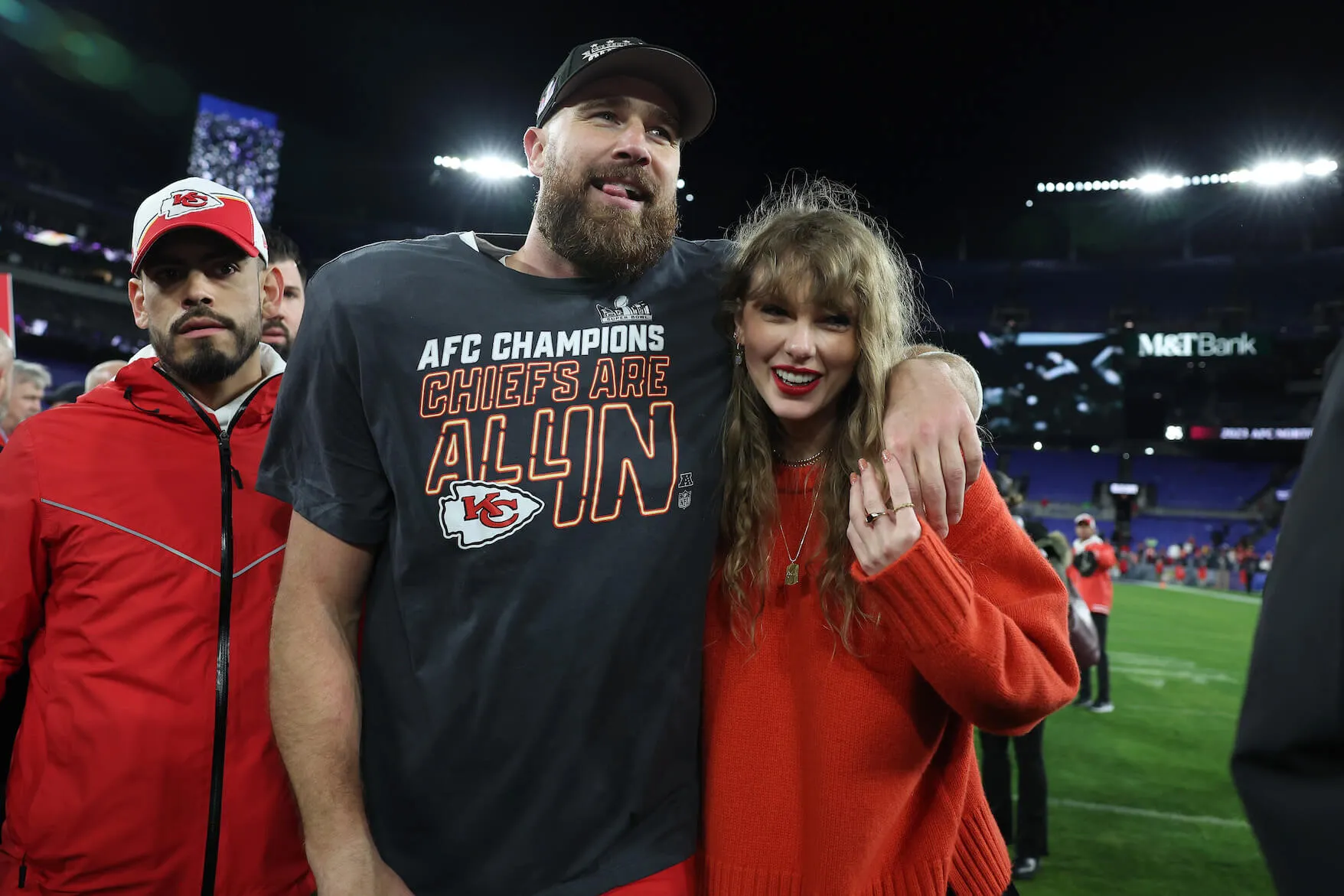 Travis Kelce with his arm around Taylor Swift after a Kansas City Chiefs game